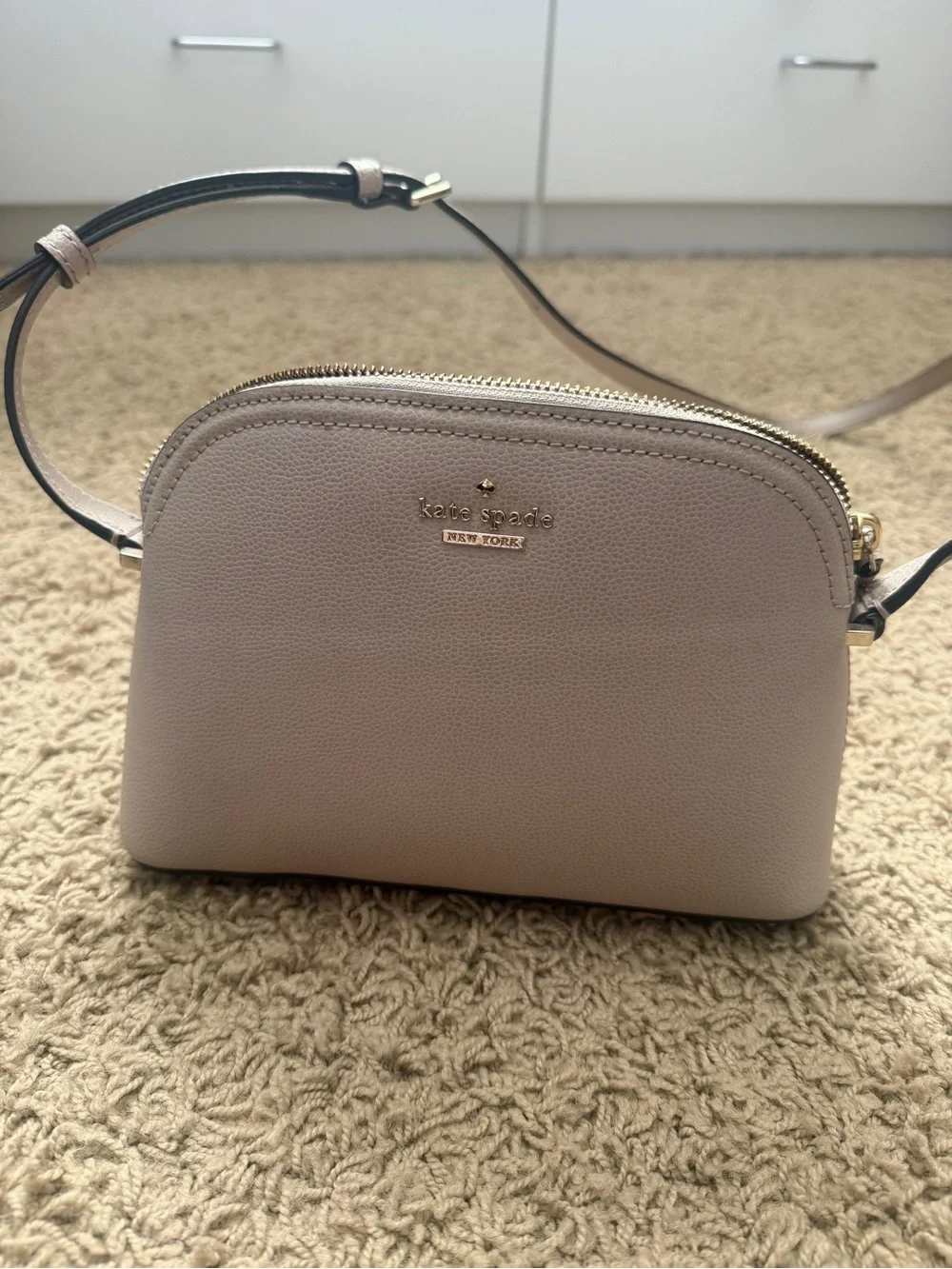 kate spade pebble leather dome crossbody in light taupe